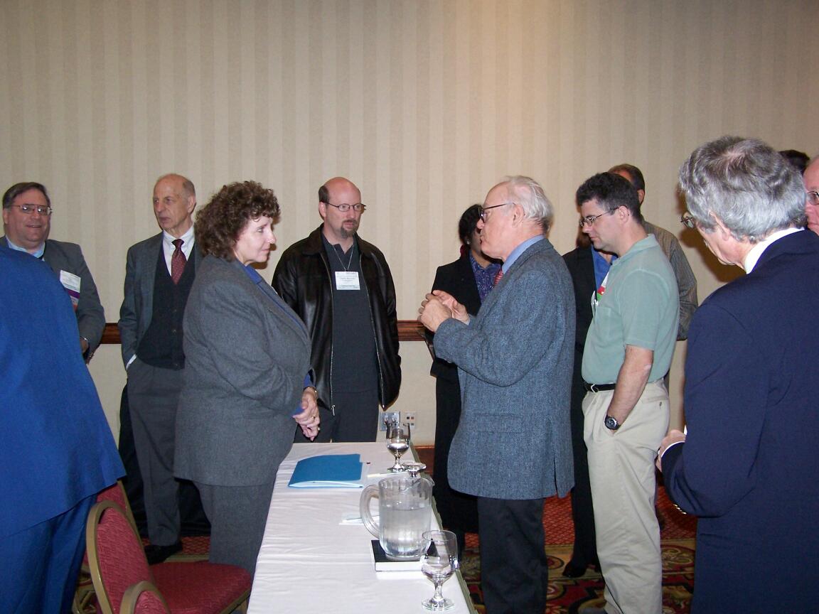 A crowd gathers around Keynote Speaker Pam Thompson of Lockheed Martin Aeronautics