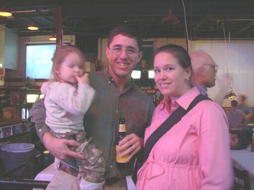 Jim Davis holding his daughter, Reilley, with his wife, Lisa