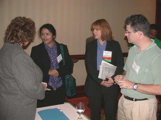 Keynote Speaker Pam Thompson interacting with attendees Bindia Hallauer, Joyce Tokar, and Chris Sparks