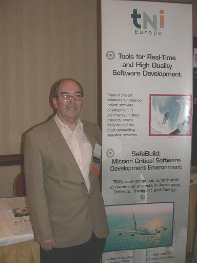 Tony Elliston in front of the TNI-Europe booth