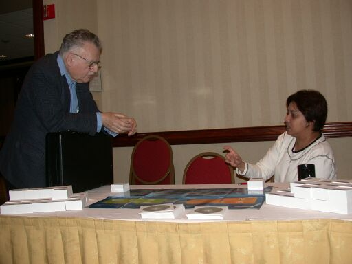 Robert Leif in discussion with Bindia Hallauer at the Microsoft table