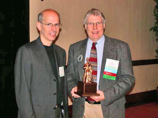 John McCormick presents the Outstanding Ada Community Contributions Award to Pascal Leroy