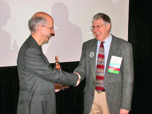 John McCormick presents the Outstanding Ada Community Contributions Award to Pascal Leroy