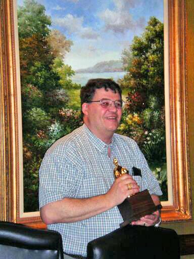 David Cook holding Les Dupaix's 2003 Lady Ada statuette